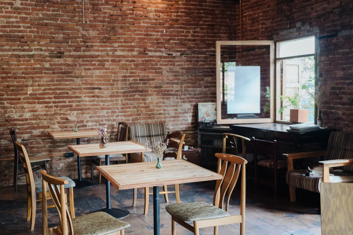 Minimalist Industrial Cafe Design with Exposed Brick